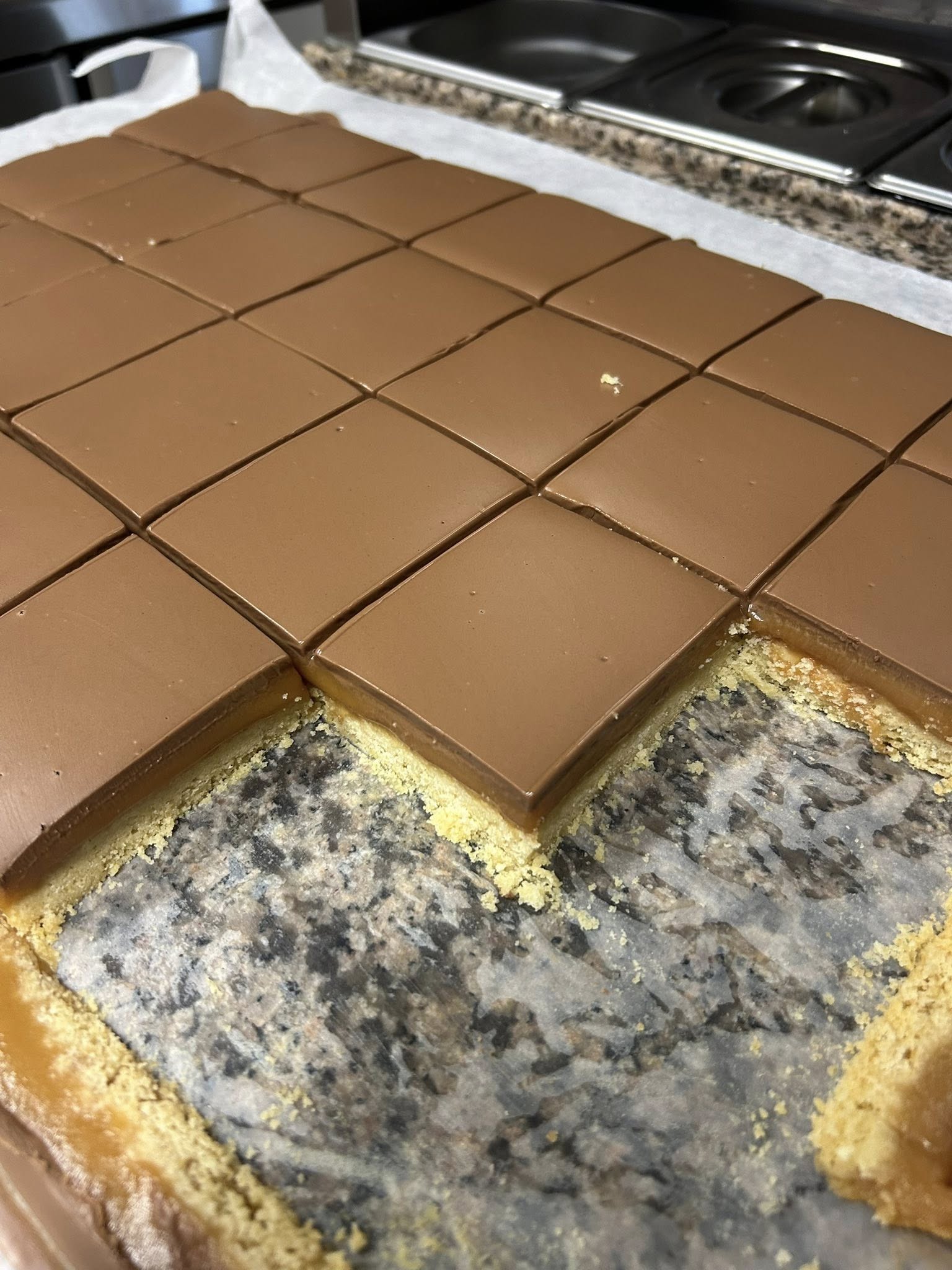 Homemade millionaire's shortbread — buttery base, thick caramel, smooth milk chocolate