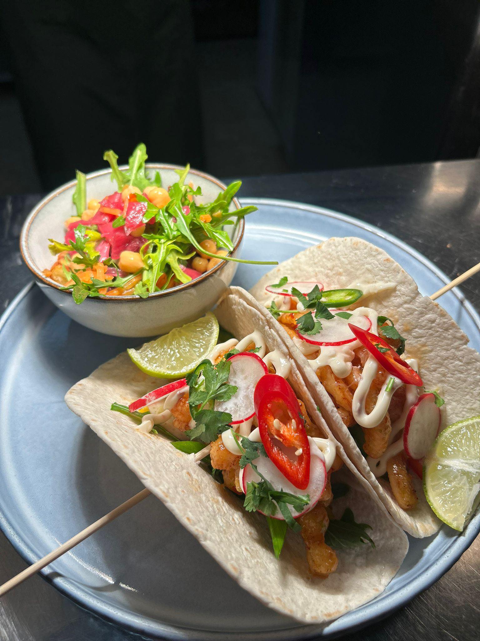 Crispy tacos with chilli, radish, coriander and a fresh chickpea salad on the side